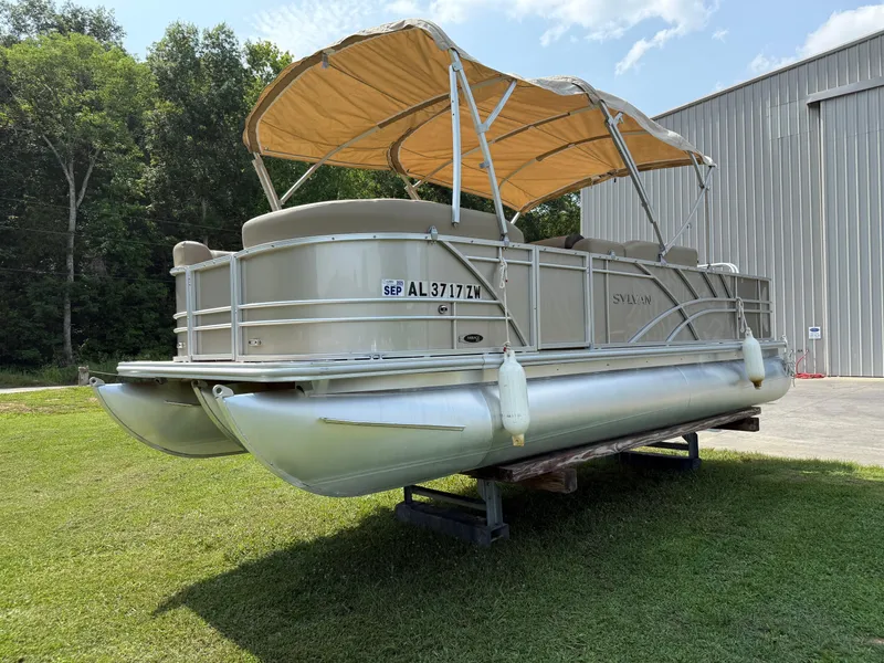 The Image of 2021 Sylvan Mirage 822 PARTY FISH pontoon boat on grass near a building. - 0