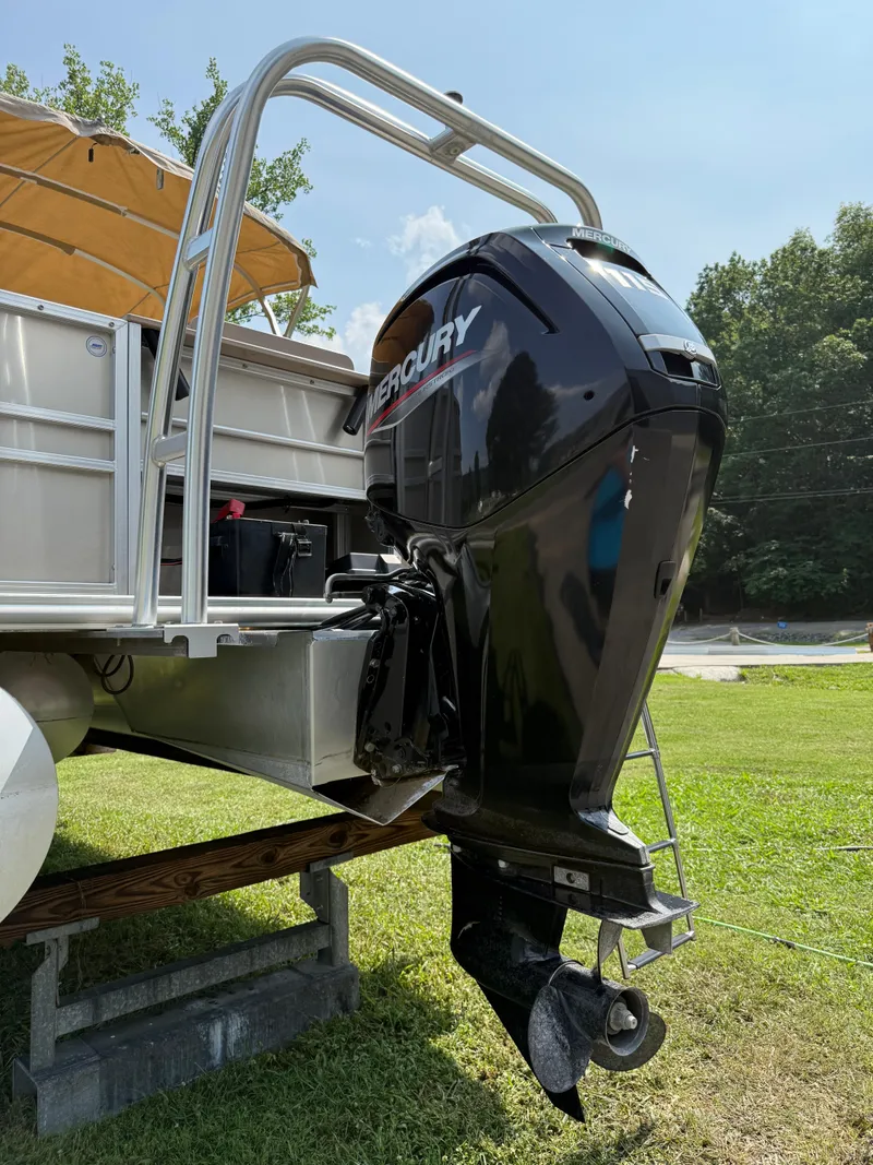 Slide: The Image of 2021 Sylvan Mirage 822 PARTY FISH boat with Mercury outboard motor on grass. - 11
