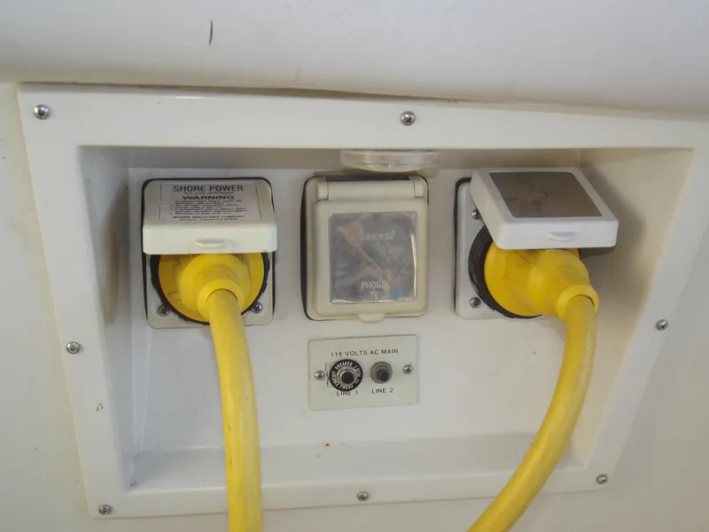 Slide: The Image of Shore power connections on a 1990 Silverton 37 Convertible boat. - 20