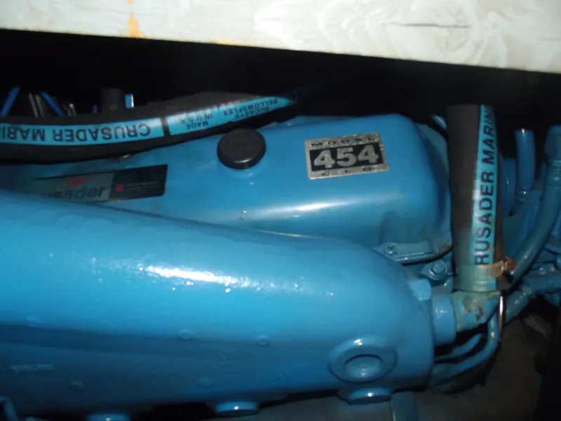 Slide: The Image of Engine of a 1990 Silverton 37 Convertible boat, featuring Crusader Marine components. - 35