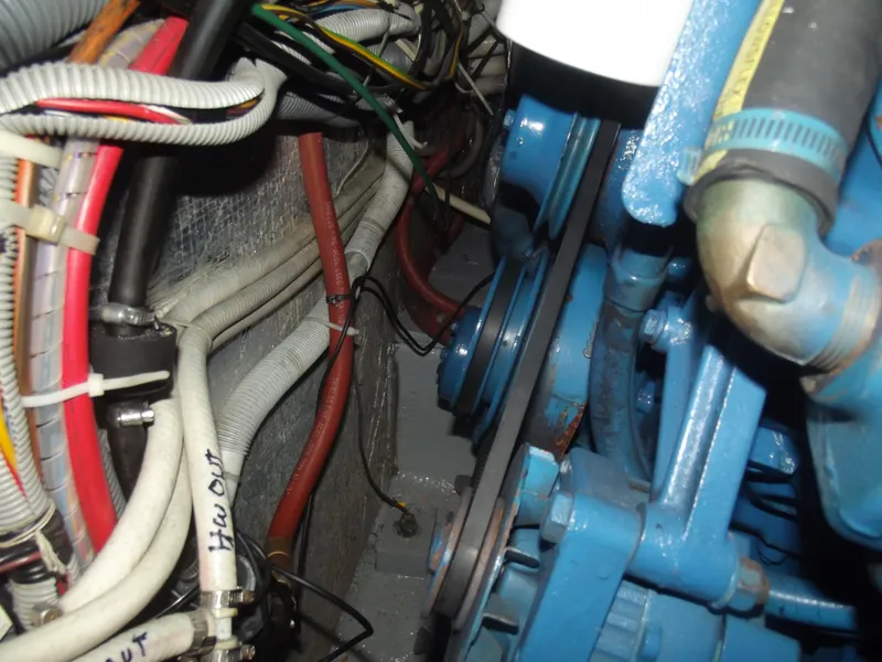 Slide: The Image of Engine compartment of a 1990 Silverton 37 Convertible with visible wiring and components. - 36