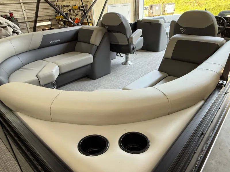 Slide: The Image of Luxurious interior of 2025 Viaggio Lago V-U boat with plush seating and cup holders. - 13