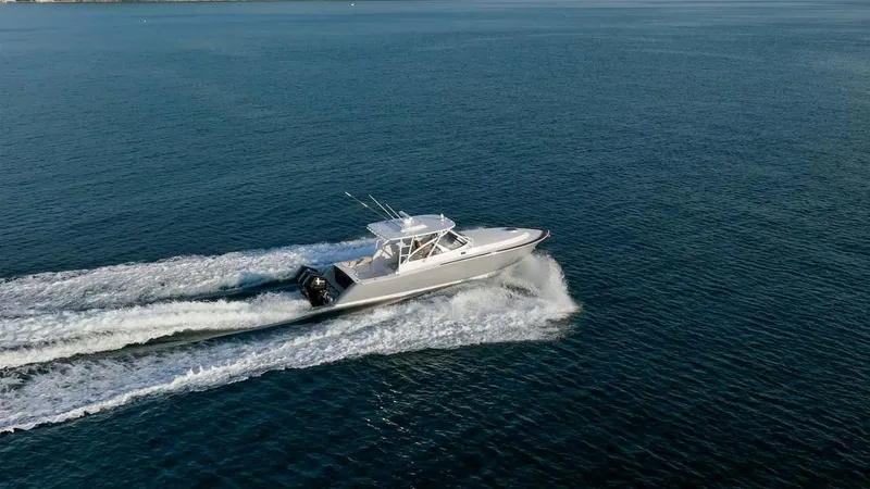 The Image of 2025 Vicem Express boat cruising on open water, creating a dynamic wake. - 1