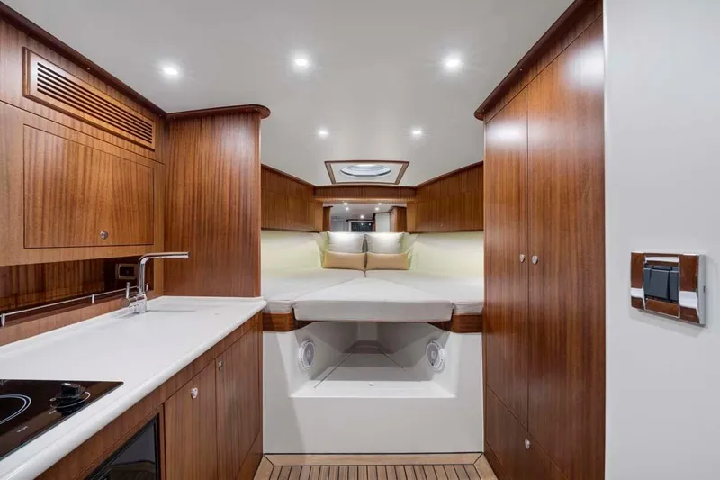 Slide: The Image of Luxurious 2025 Vicem Express yacht interior with wood finish and modern amenities. - 3