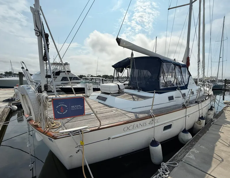 Slide: The Image of 2003 Beneteau Oceanis 42CC sailboat docked at marina, side view. - 10