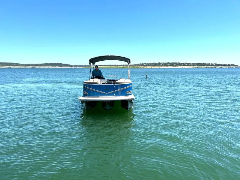Slide: The Image of 2022 Avalon 24 LSZ VRB-3 pontoon boat on a sunny lake. - 10