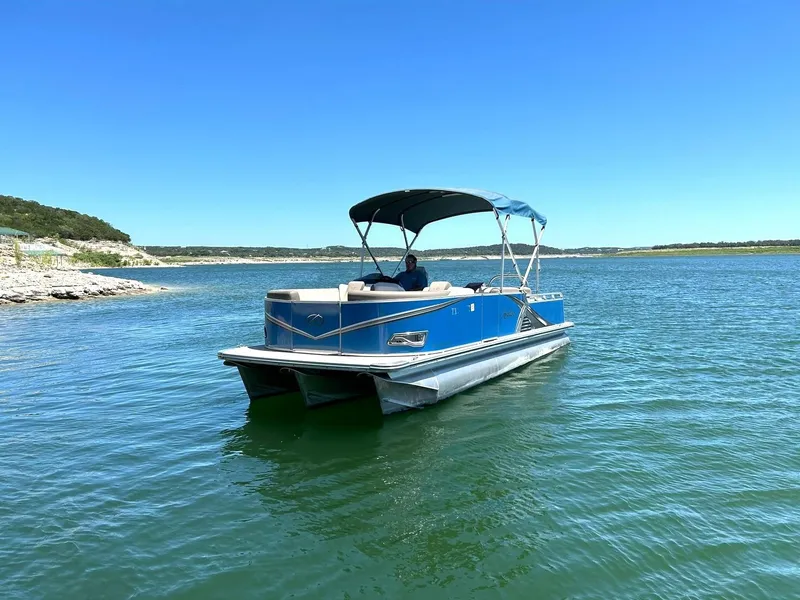 Slide: The Image of 2022 Avalon 24 LSZ VRB-3 pontoon boat on a sunny lake. - 11