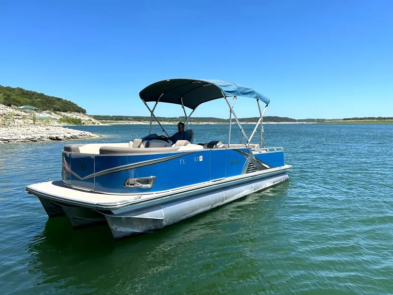 Slide: The Image of 2022 Avalon 24 LSZ VRB-3 pontoon boat on a sunny lake. - 12