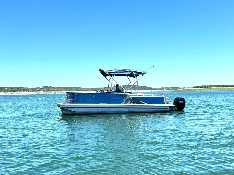 Slide: The Image of 2022 Avalon 24 LSZ VRB-3 pontoon boat on a sunny lake. - 14