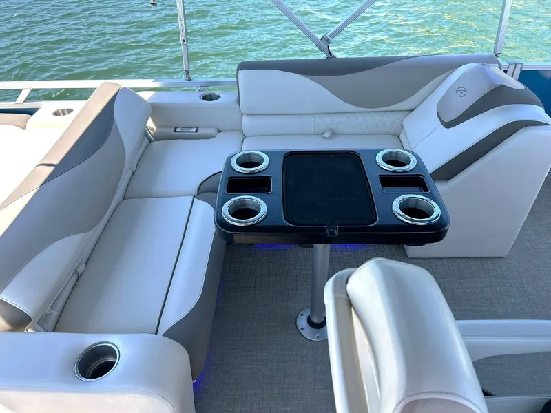 Slide: The Image of Luxurious seating area on 2022 Avalon 24 LSZ VRB-3 pontoon boat with cup holders. - 35