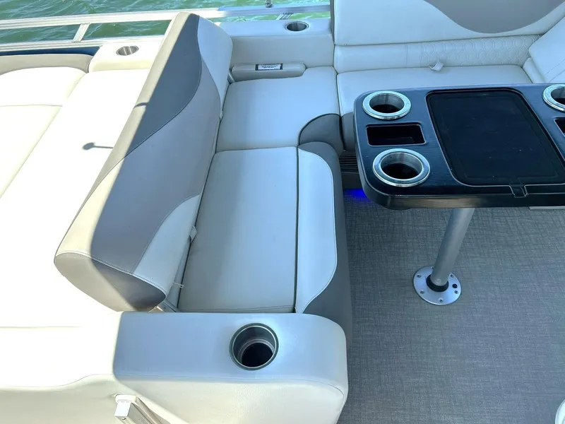 Slide: The Image of Luxurious seating and table setup on 2022 Avalon 24 LSZ VRB-3 pontoon boat. - 37
