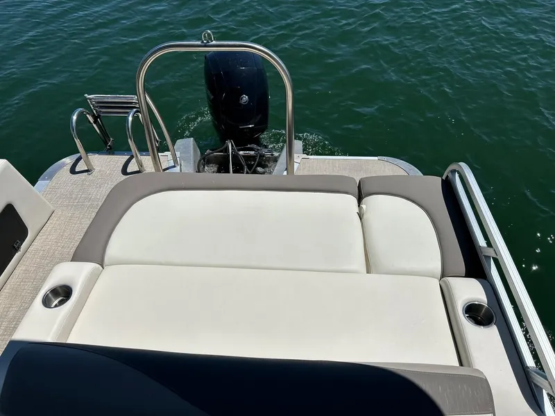 Slide: The Image of 2022 Avalon 24 LSZ VRB-3 boat with rear seating and motor on water. - 38