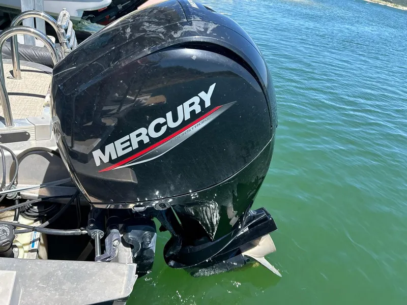 Slide: The Image of Mercury outboard motor on 2022 Avalon 24 LSZ VRB-3 pontoon boat in water. - 46