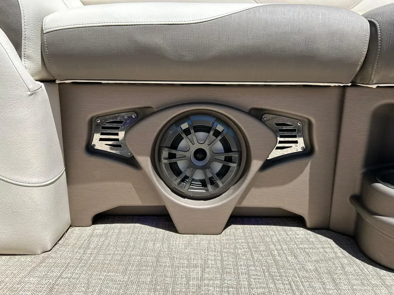 Slide: The Image of 2022 Avalon 24 LSZ VRB-3 boat interior speaker detail with beige upholstery. - 49
