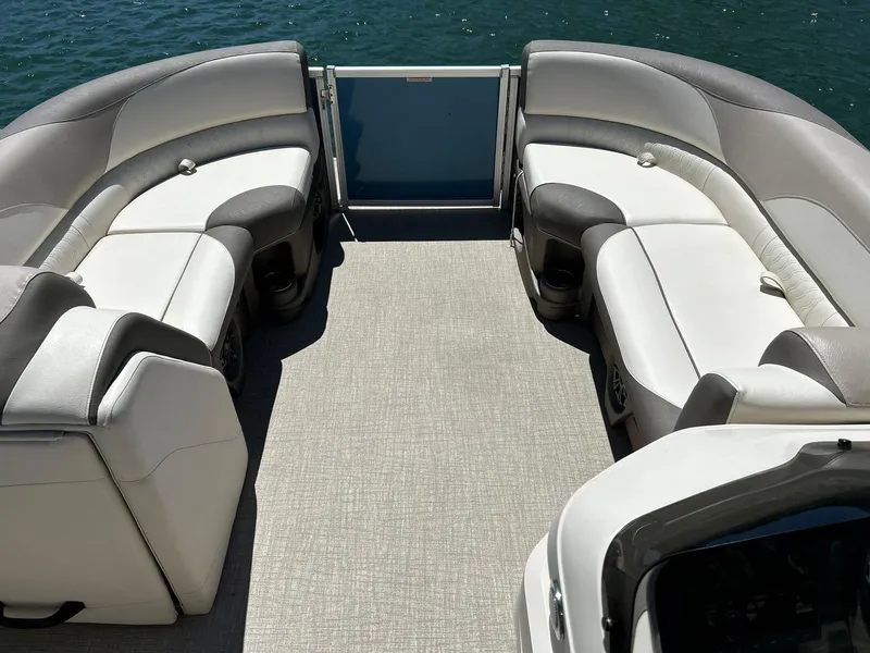 Slide: The Image of 2022 Avalon 24 LSZ VRB-3 pontoon boat interior with plush seating and lake view. - 5