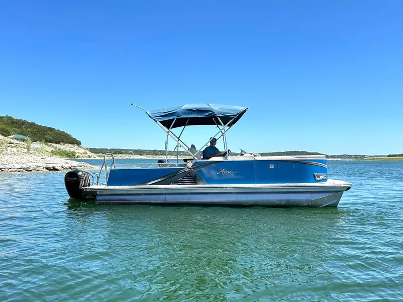 Slide: The Image of 2022 Avalon 24 LSZ VRB-3 pontoon boat on a sunny lake. - 8