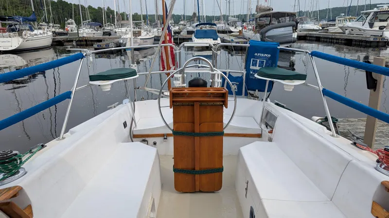 Slide: The Image of Cockpit view of a 1988 Catalina 30 MkII sailboat docked at a marina. - 10