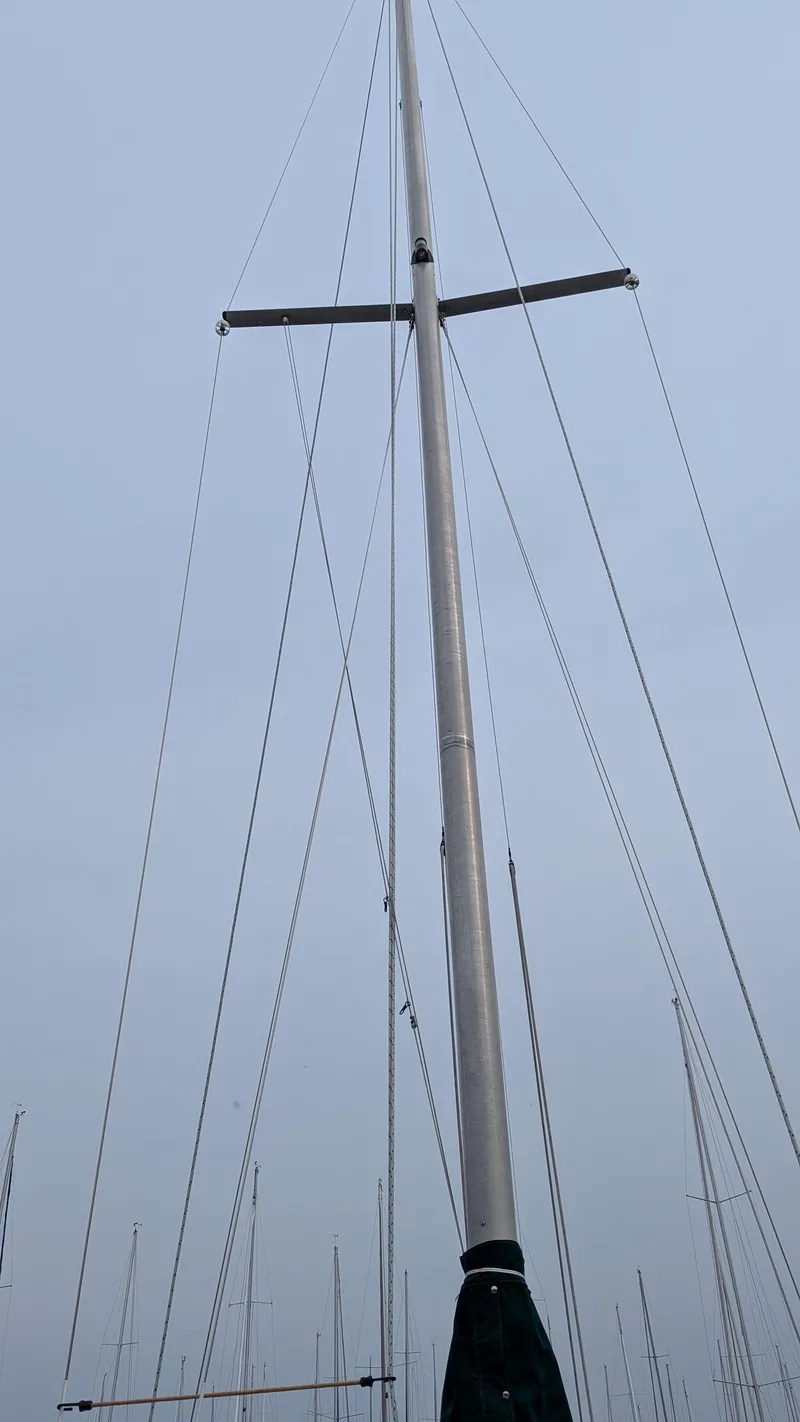 Slide: The Image of Mast of 1988 Catalina 30 MkII sailboat against a cloudy sky. - 14