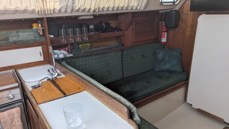 Slide: The Image of Interior of a 1988 Catalina 30 MkII sailboat with kitchenette and seating area. - 18