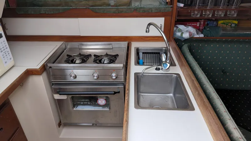 Slide: The Image of Galley kitchen in 1988 Catalina 30 MkII with stove, sink, and faucet. - 23