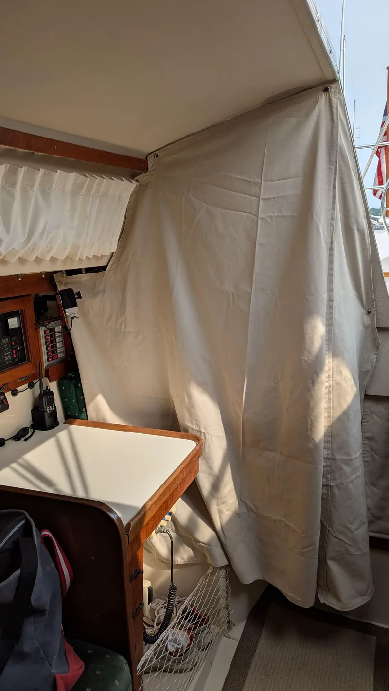 Slide: The Image of Interior of 1988 Catalina 30 MkII sailboat with navigation equipment and curtain. - 29
