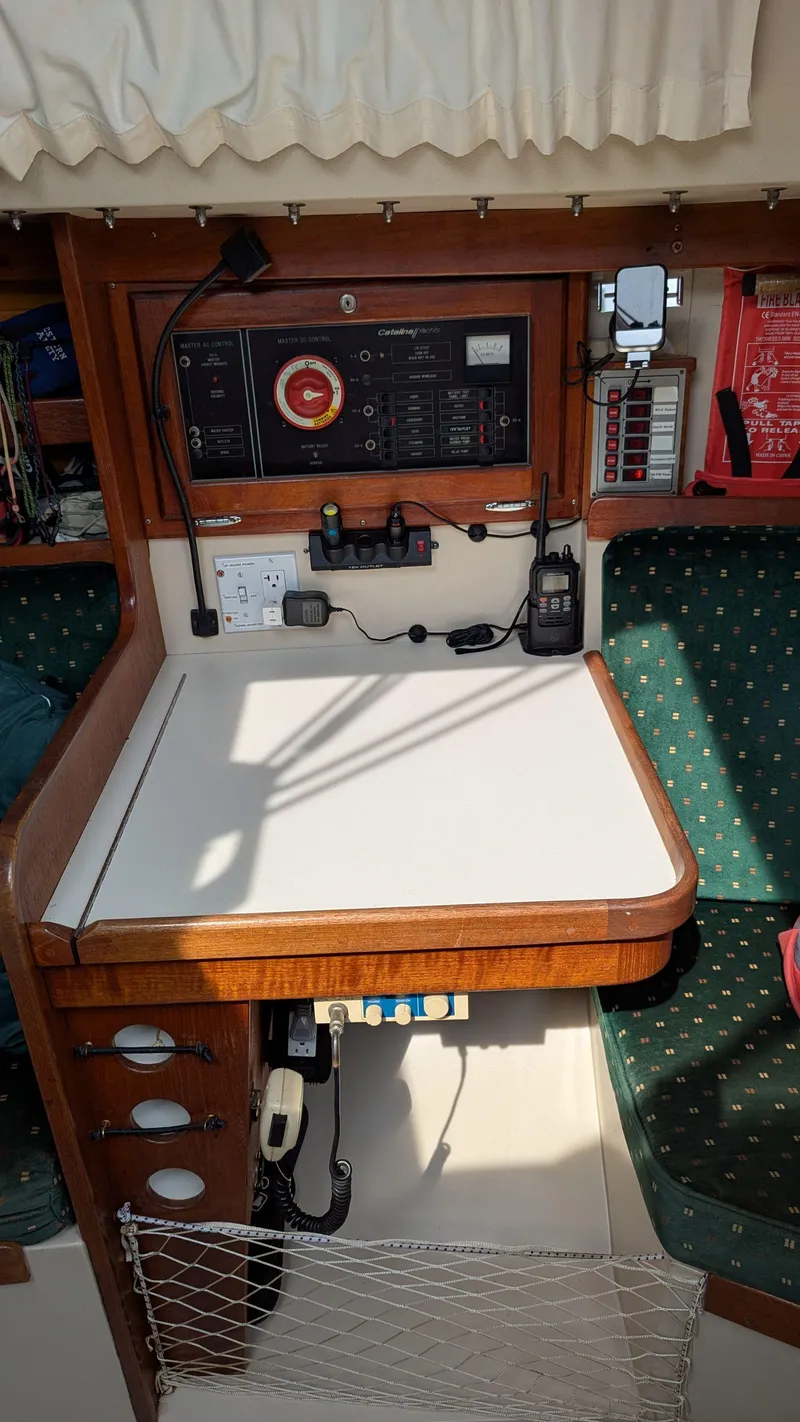Slide: The Image of Interior of a 1988 Catalina 30 MkII sailboat with navigation equipment and seating area. - 31