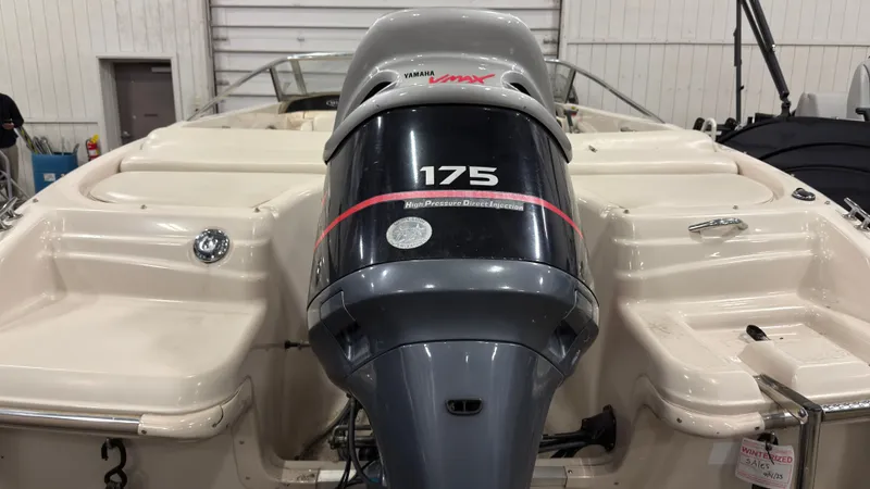 Slide: The Image of 2002 Larson 210 SEI boat with Yamaha 175 HP outboard motor. - 3