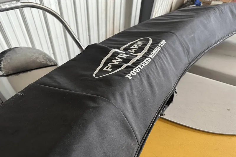 Slide: The Image of Black PWR-ARM powered bimini top on Neptune 23 boat, 2005 model. - 10