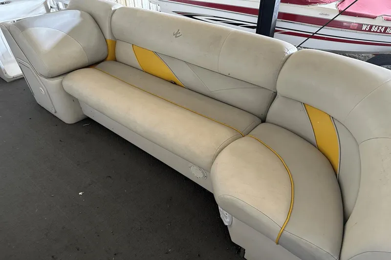 Slide: The Image of Beige and yellow boat seat from a 2005 Neptune 23 model. - 11