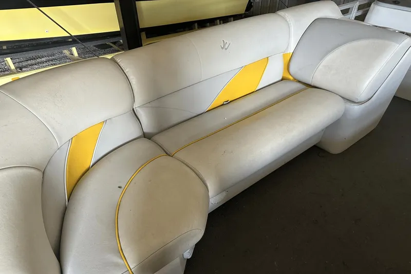 Slide: The Image of White and yellow boat seat from a 2005 Neptune 23 model. - 12