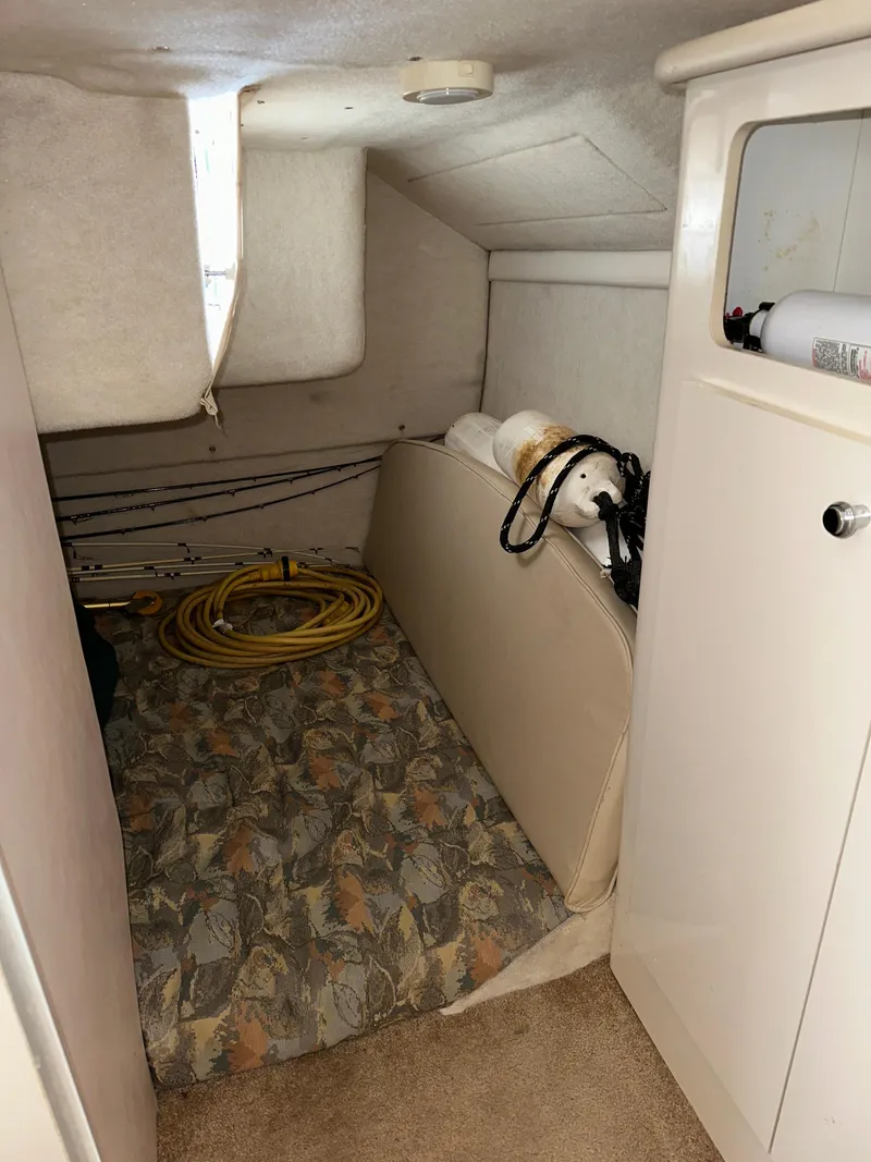 Slide: The Image of Interior cabin of 2000 Bayliner 2855 Ciera with storage and equipment. - 12