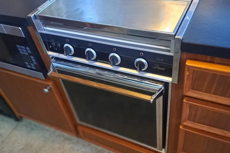 Slide: The Image of Vintage stove in a 1978 Hatteras 37 Convertible yacht kitchen. - 17