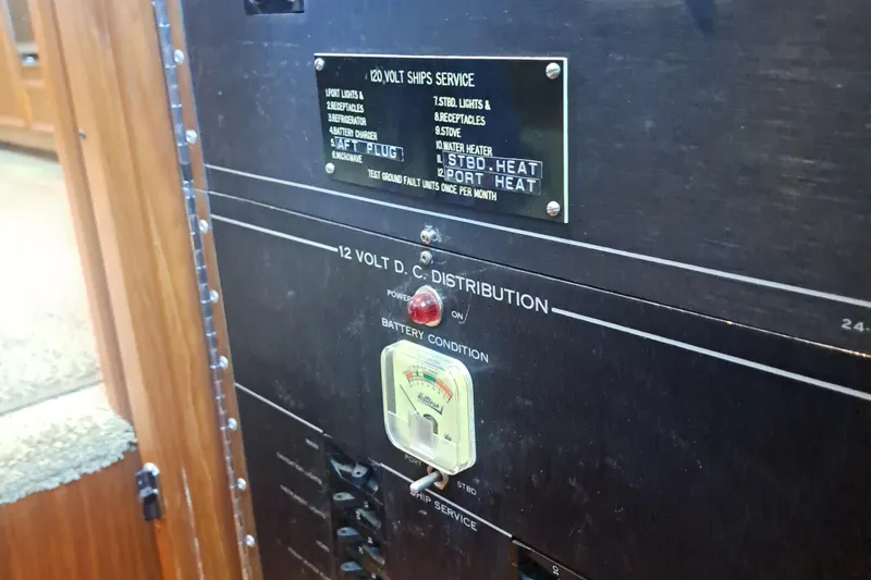 Slide: The Image of Electrical panel on a 1978 Hatteras 37 Convertible boat, showing voltage distribution. - 19