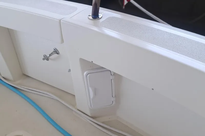 Slide: The Image of 1978 Hatteras 37 Convertible boat deck with storage compartment and blue cable. - 42