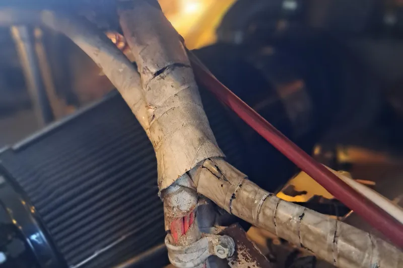 Slide: The Image of Close-up of engine components in a 1978 Hatteras 37 Convertible boat. - 48