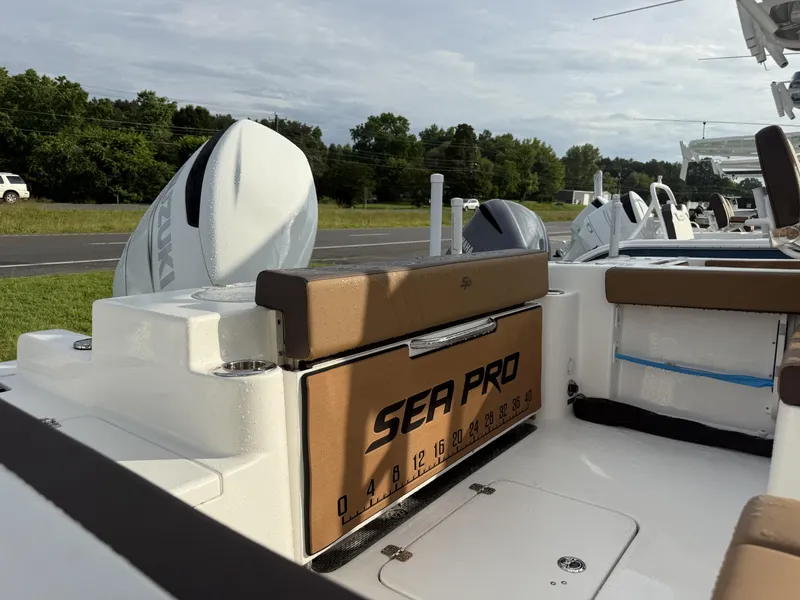 Slide: The Image of 2025 Sea Pro 240 DLX boat interior with Suzuki engine, featuring comfortable seating and modern design. - 3