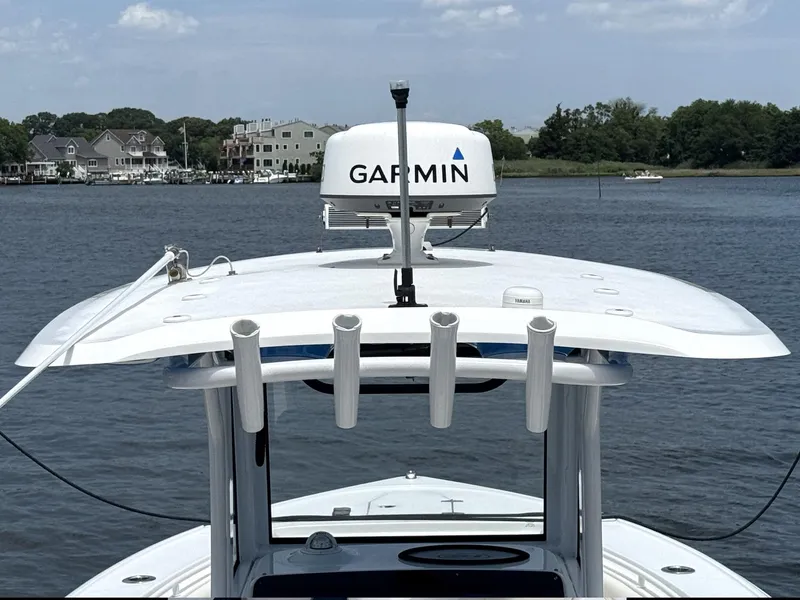 Slide: The Image of 2022 Sea Hunt Ultra 275 SE boat with Garmin radar on calm water. - 15