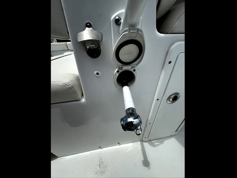 Slide: The Image of 2022 Sea Hunt Ultra 275 SE boat interior with rod holder and cup holder. - 7