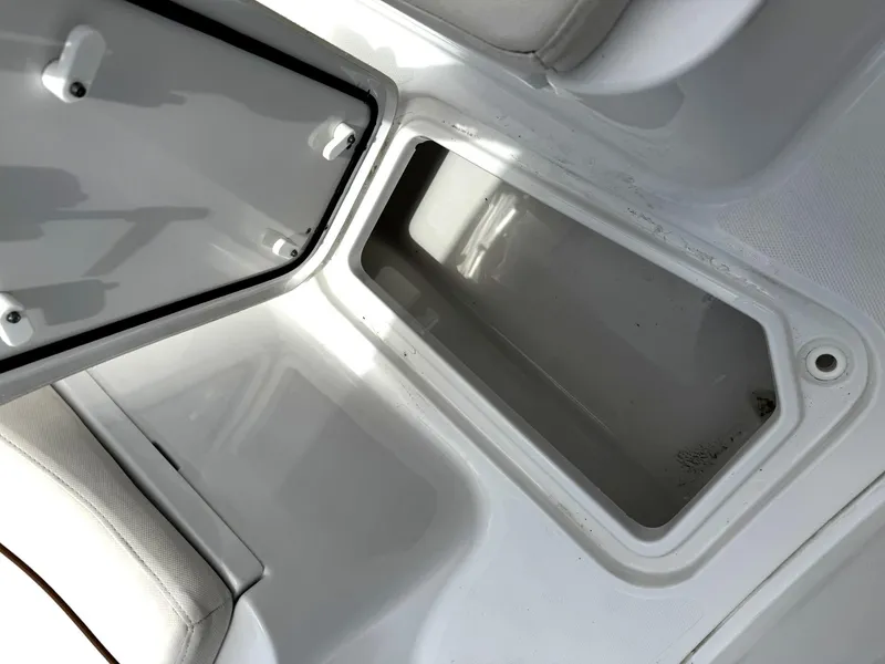 Slide: The Image of Open storage compartment on a 2022 Sea Hunt Ultra 275 SE boat. - 8
