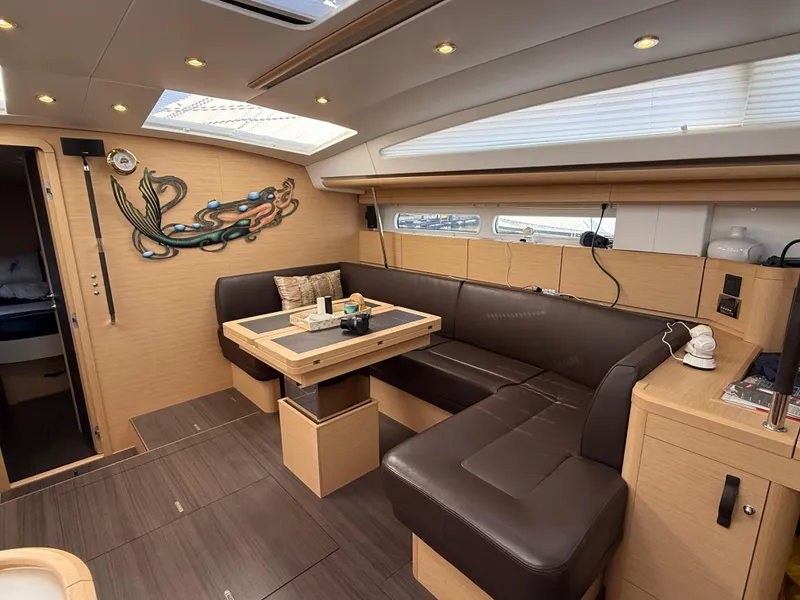 Slide: The Image of Luxurious interior of 2016 Jeanneau Yachts 58 with modern kitchen and seating area. - 17