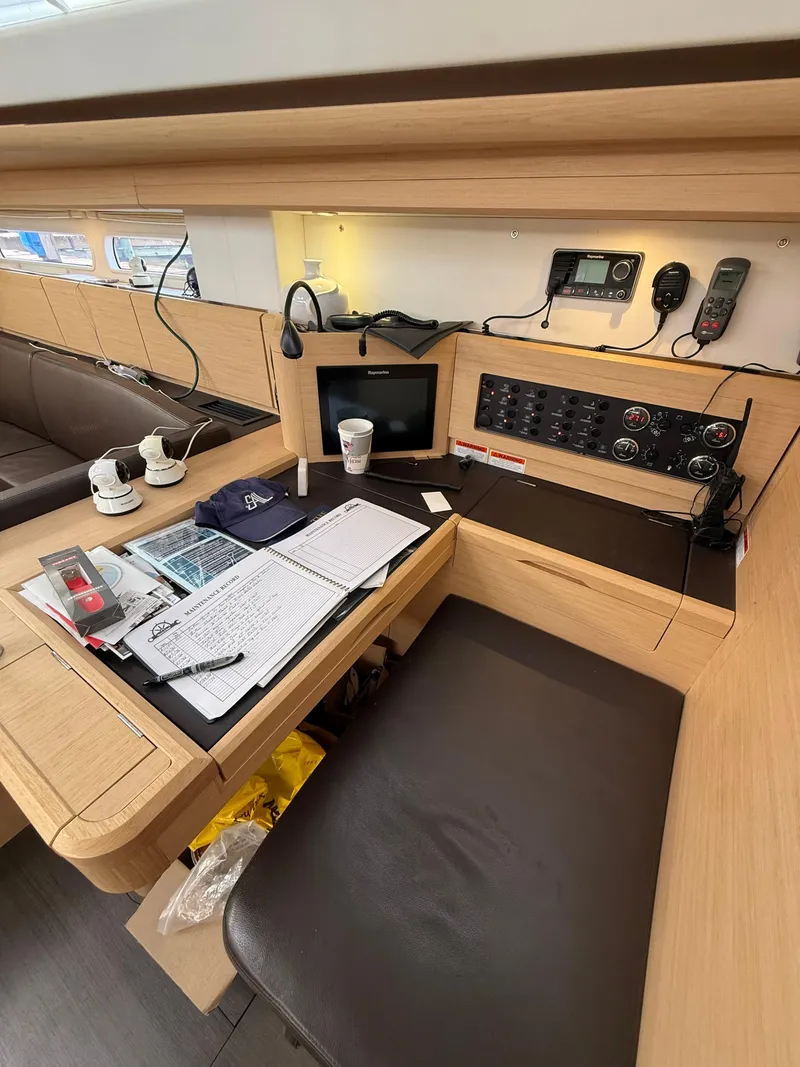 Slide: The Image of Compact bathroom in 2016 Jeanneau Yachts 58, featuring toilet, sink, and storage cabinets. - 20