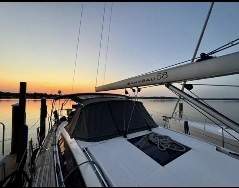Slide: The Image of Sail of a 2016 Jeanneau Yachts 58 against a clear blue sky. - 5