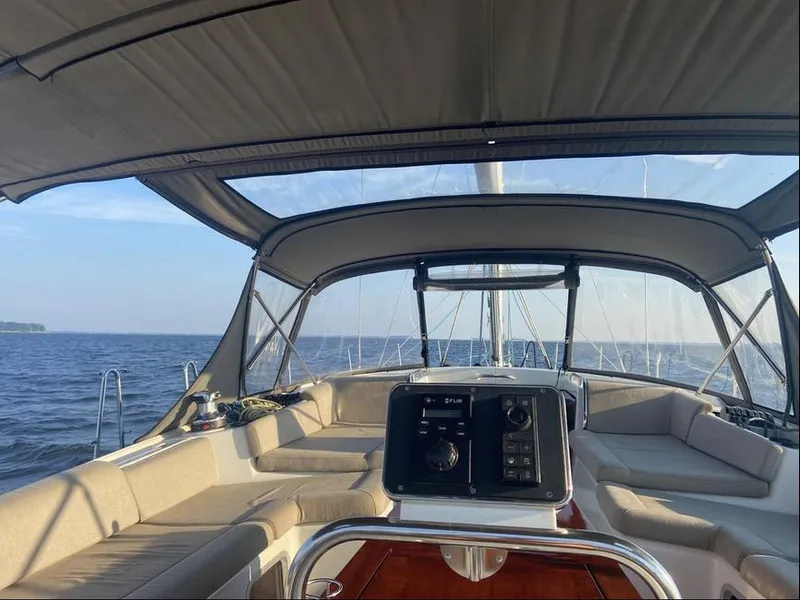 Slide: The Image of 2016 Jeanneau Yachts 58 at sunset, docked by calm waters. - 6