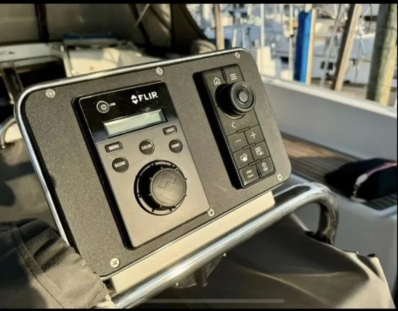 Slide: The Image of Control panel on 2016 Jeanneau Yachts 58, featuring FLIR system and joystick. - 10