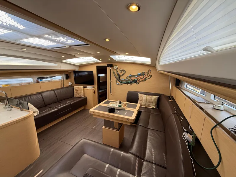 Slide: The Image of Luxurious interior of 2016 Jeanneau Yachts 58 with leather seating and modern decor. - 14