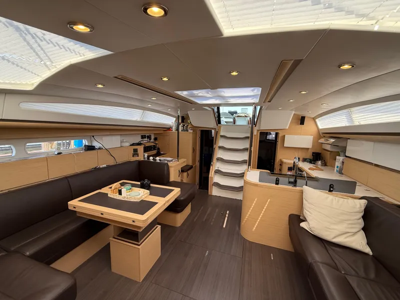 Slide: The Image of Luxurious interior of 2016 Jeanneau Yachts 58 with modern furnishings and ample natural light. - 15