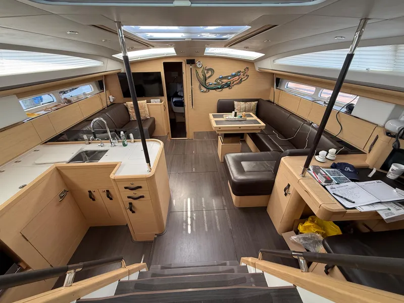 Slide: The Image of Luxurious interior of 2016 Jeanneau Yachts 58 with modern kitchen and seating area. - 16