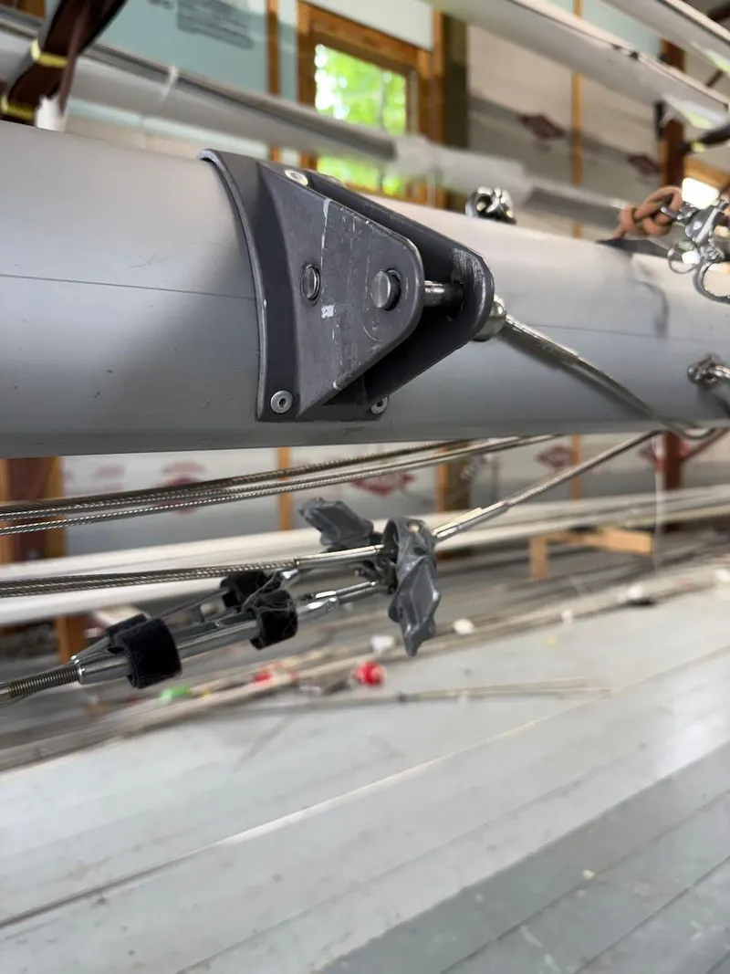 Slide: The Image of Close-up of a 2006 Mas Mini Transat 6.50 sailboat mast with rigging details. - 12