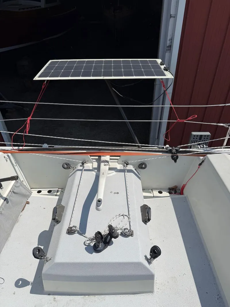 Slide: The Image of 2006 Mas Mini Transat 6.50 sailboat with solar panel installation. - 28