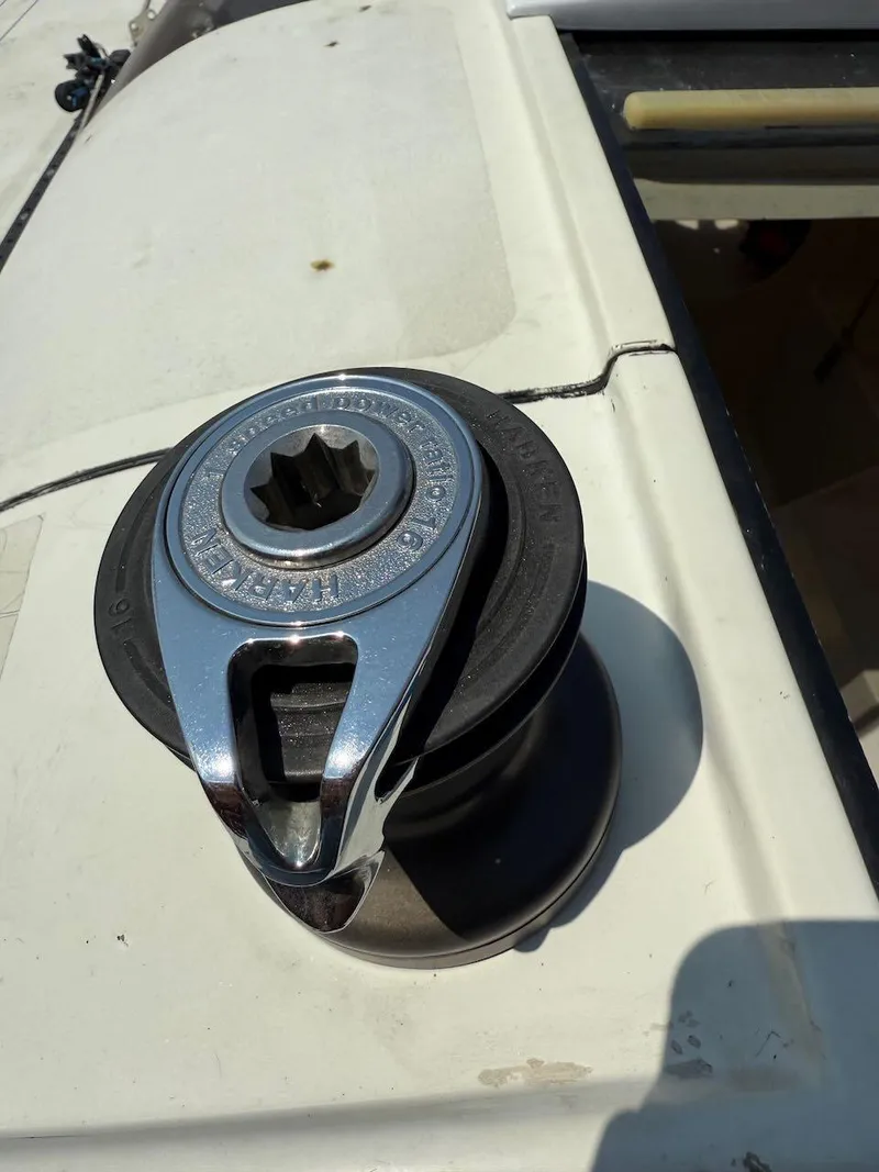 Slide: The Image of Winch on 2006 Mas Mini Transat 6.50 sailboat deck, close-up view. - 33